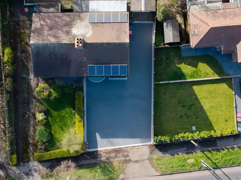 Aerial view of a resin driveway at a detached house