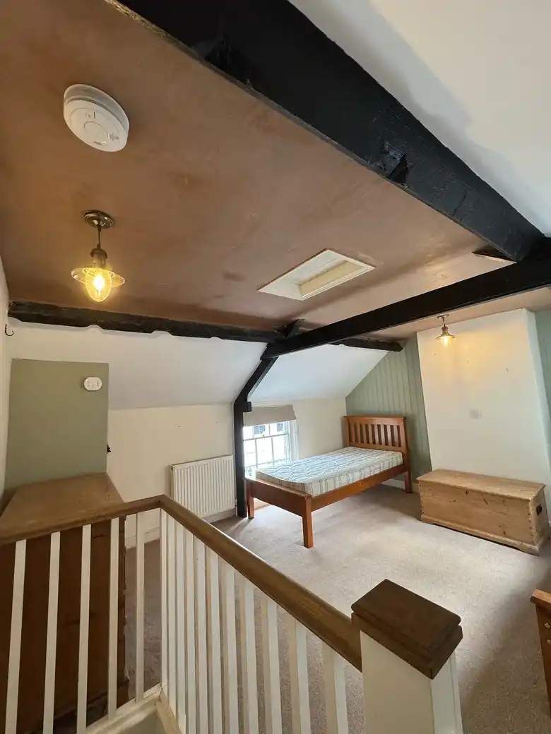 Attic room seen from the top of the stairs