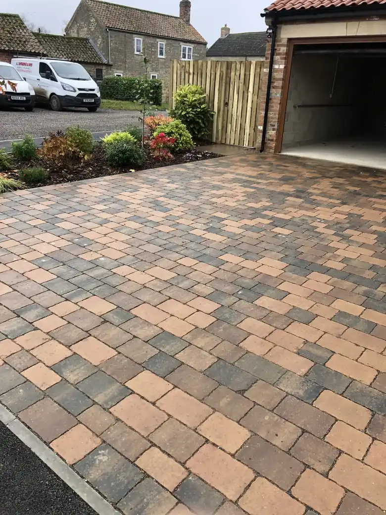Block paved driveway with curved edge