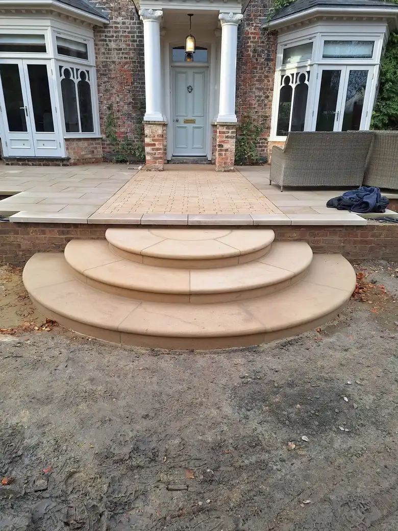 Curved sandstone steps to a Georgian house