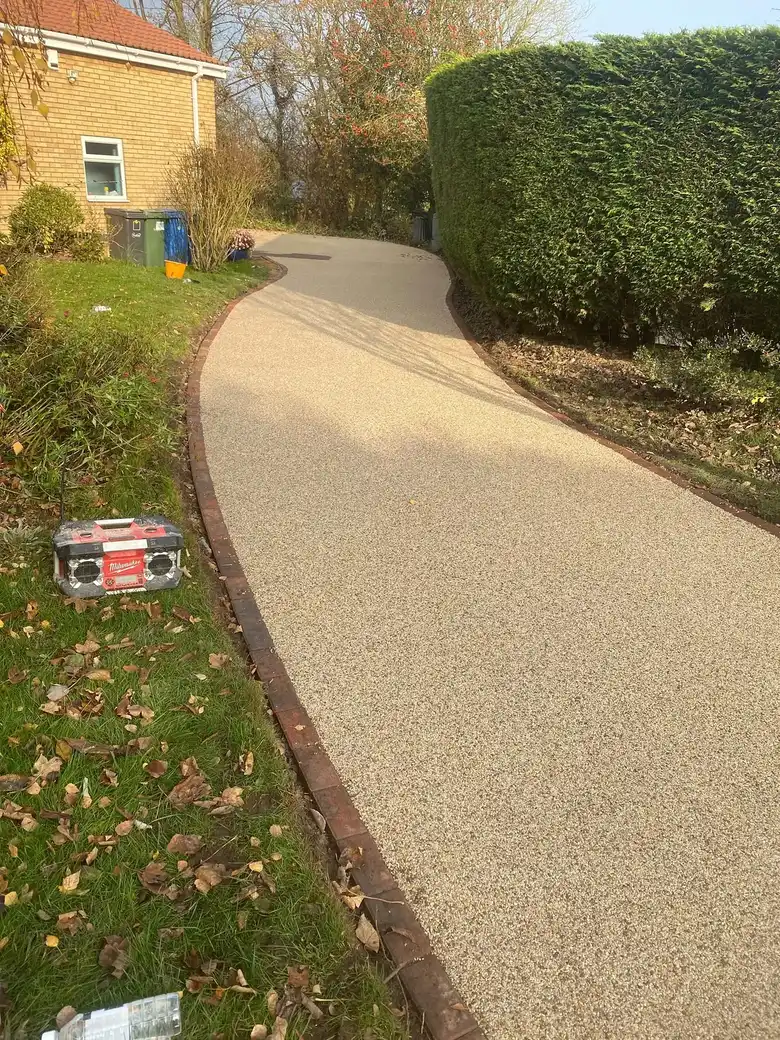 Curving resin path through a garden