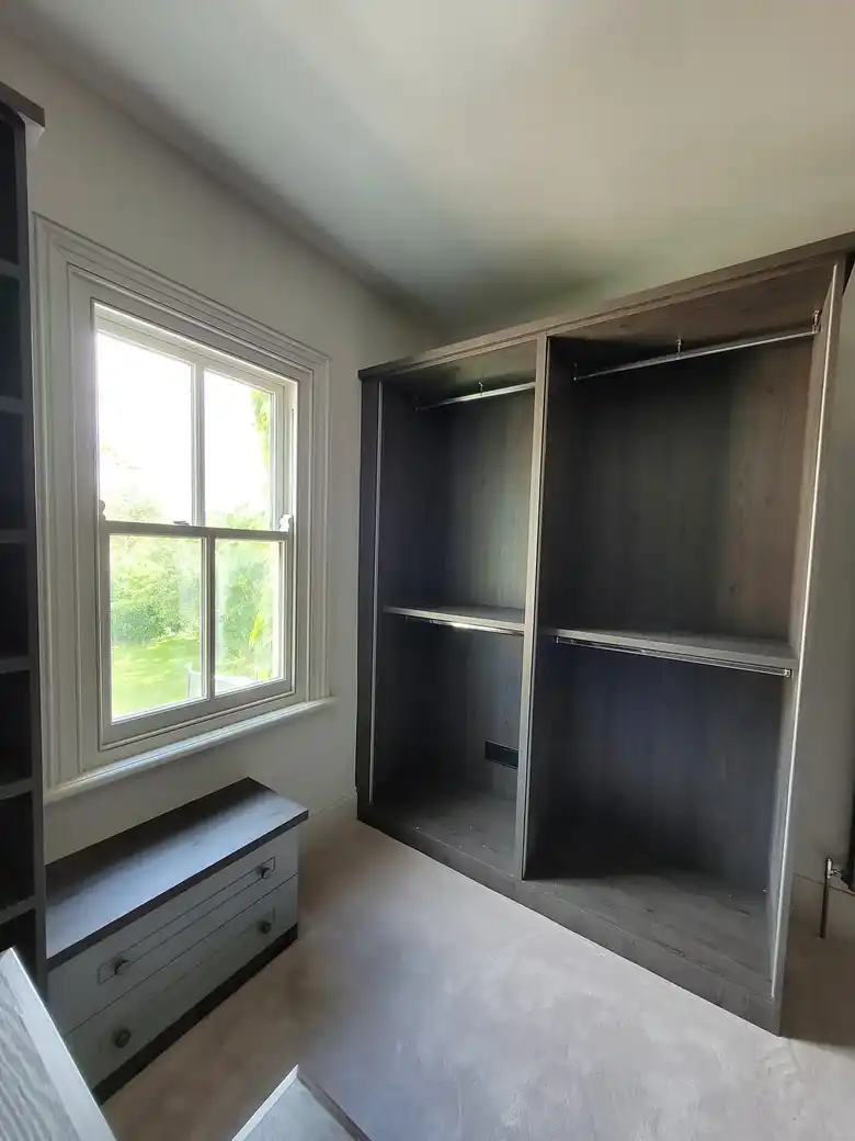 Desk and shelving built around a window