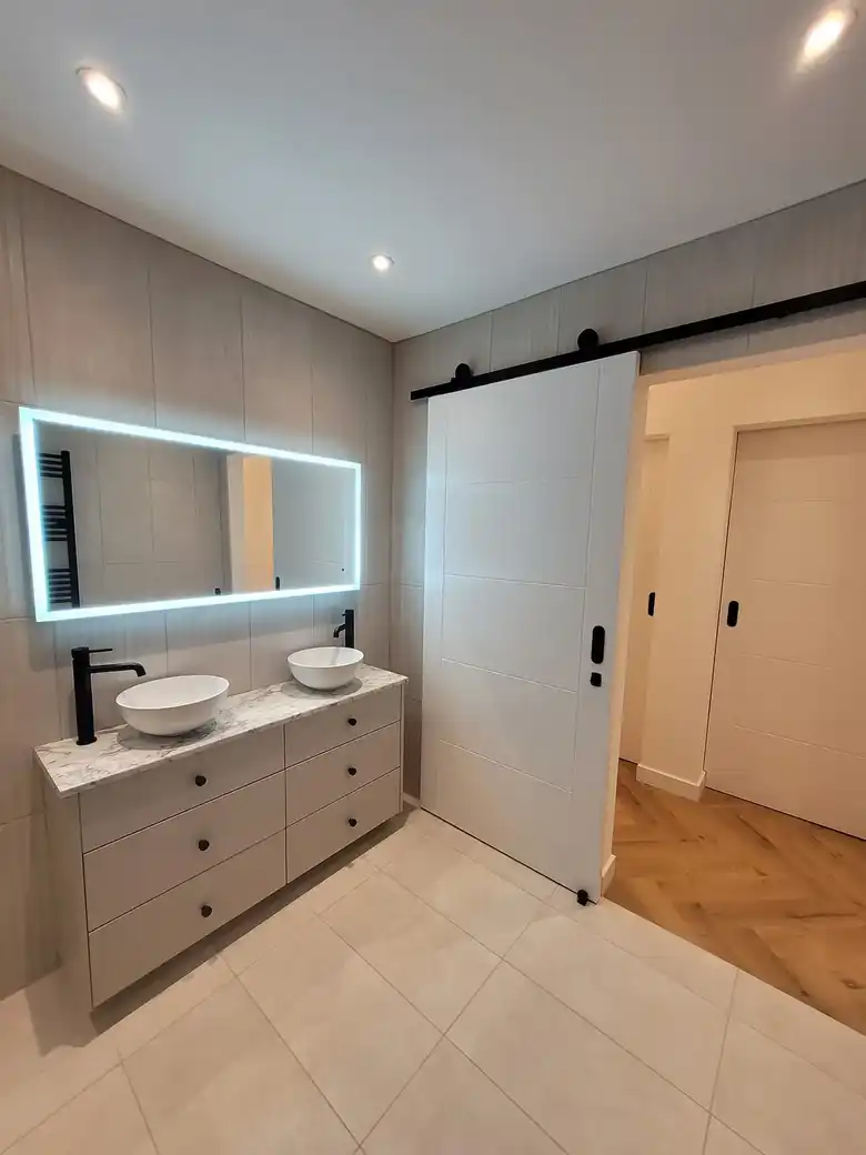 Double vanity with lit mirror
