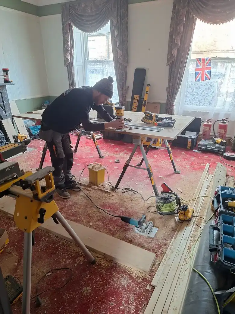Joiner cutting boards in a room under renovation