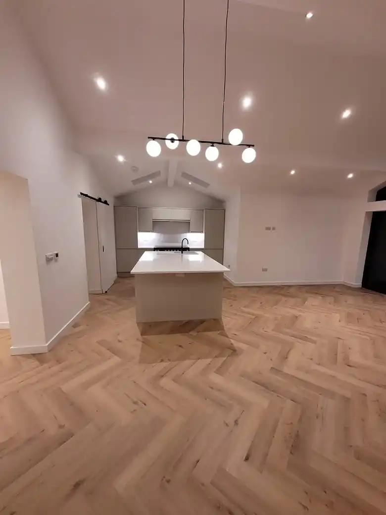 Kitchen with pendant lights under the vaulted ceiling