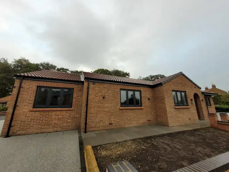 Mallorie Court bungalow with its new brick frontage