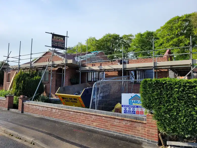 Mallorie Court under scaffold from the road