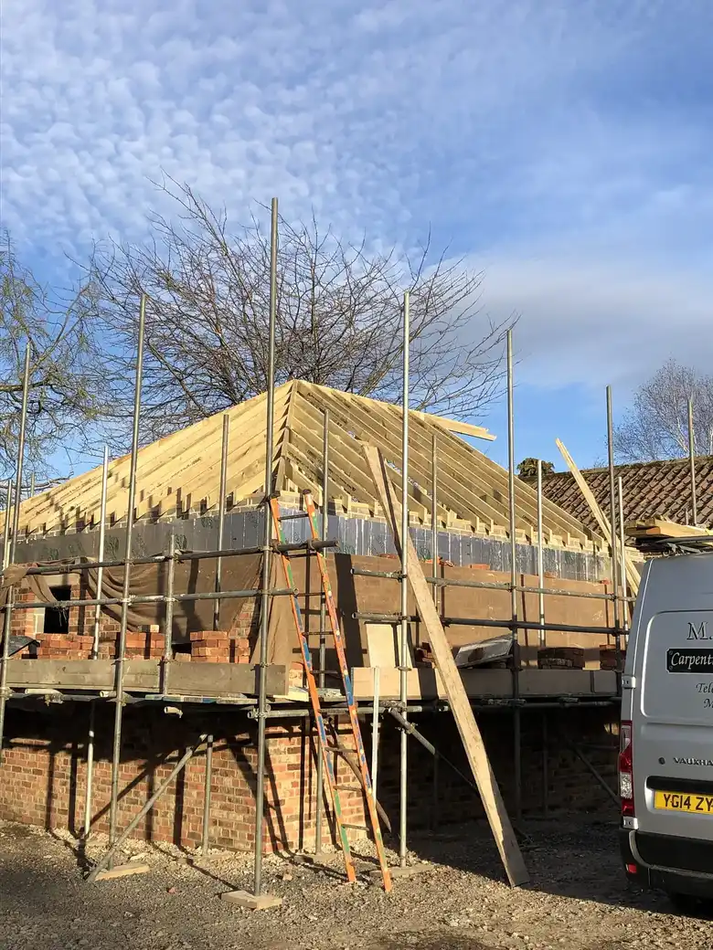 Hipped roof structure on scaffold