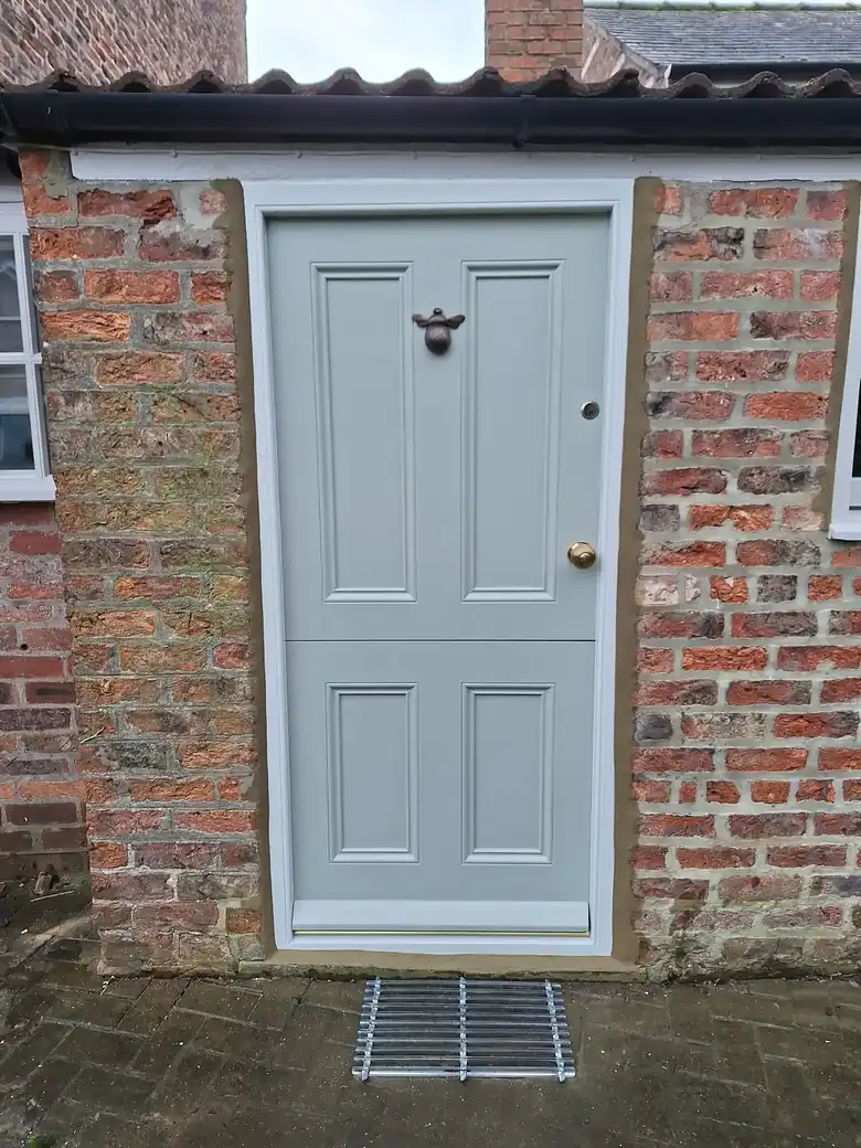 Painted front door in a brick cottage