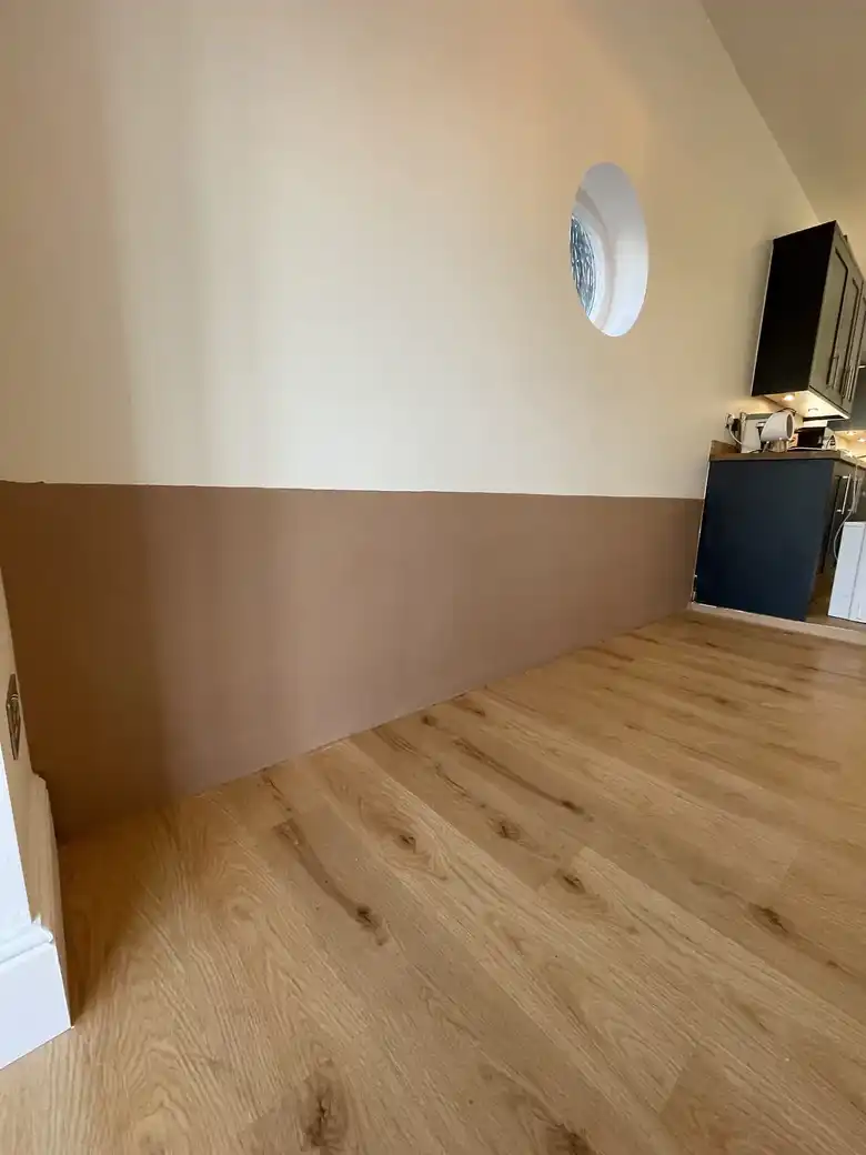 Painted room with oak floor after plastering