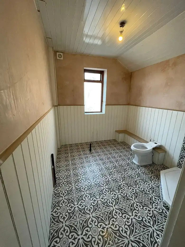 Patterned floor tiles and panelling