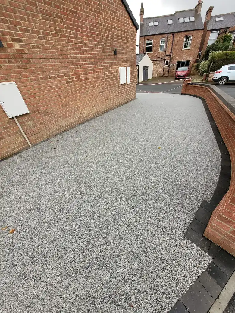 Resin driveway and brick walls at Mallorie Court