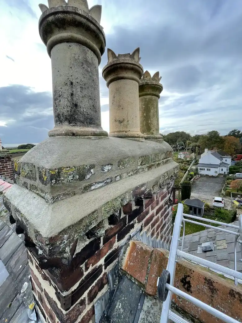 Restored chimney pots on a stone stack