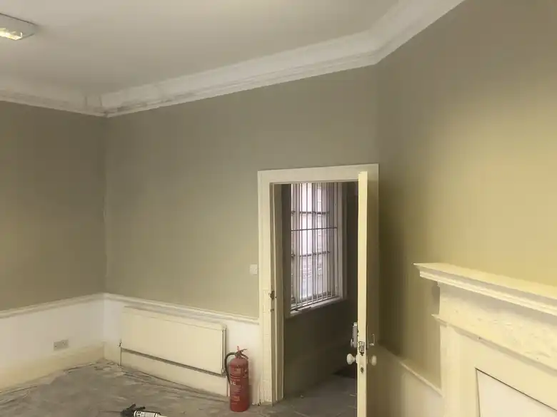 Room redecorated with a painted dado and cornice
