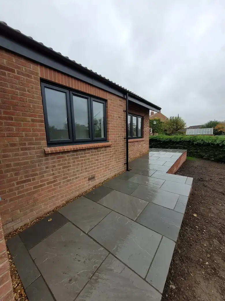 Sandstone path along the side of the bungalow