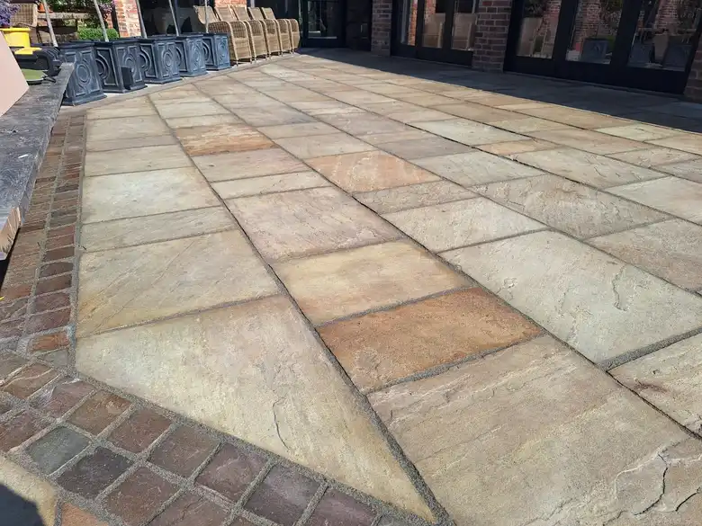 Sandstone patio with brick edge