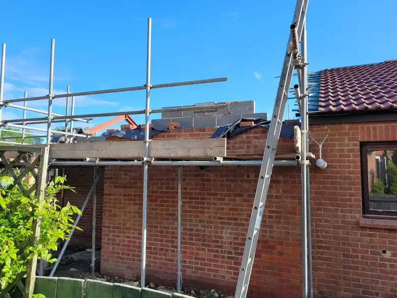 Scaffold up around the old bungalow