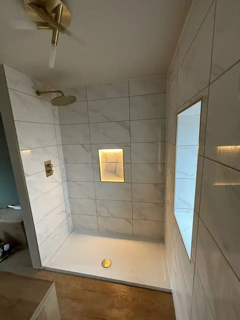 Shower niche in marble effect tiles