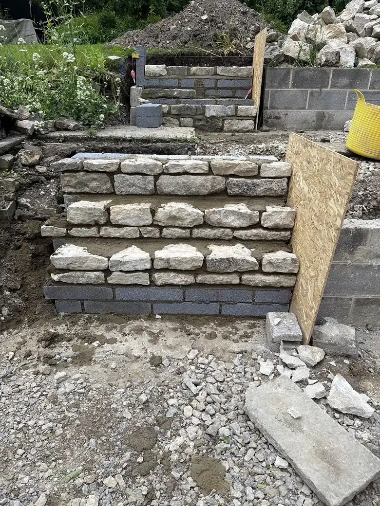 Stone faced retaining wall and steps