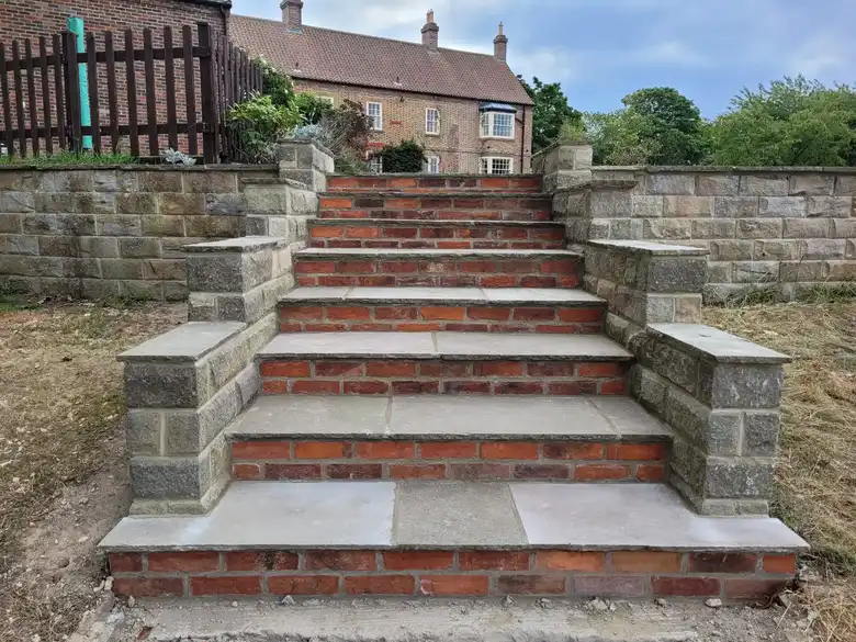 Stone garden steps with brick risers