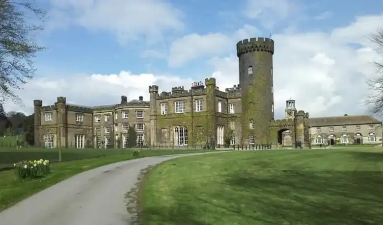 Swinton Park near Masham, a castellated stone country house with a round tower