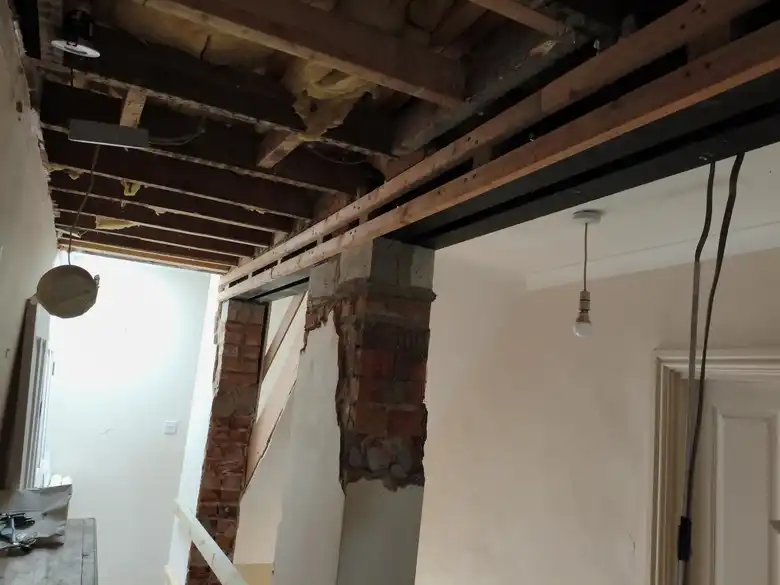 Wall opened up on a new steel inside the cottage