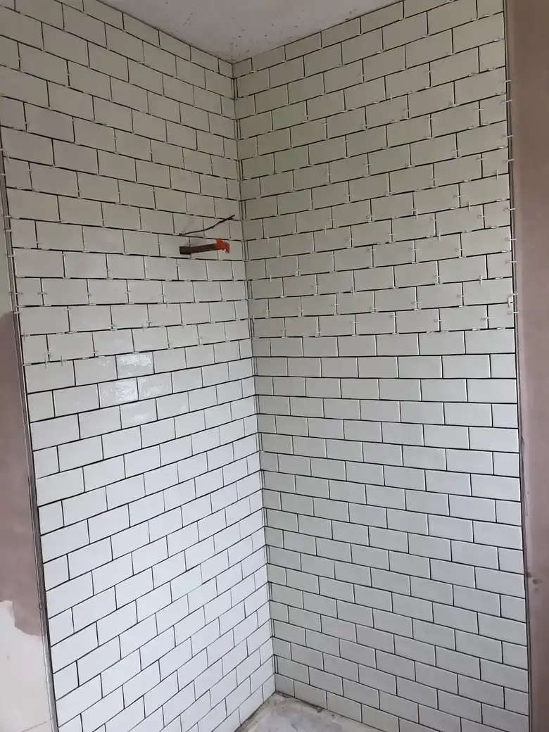 White metro tiles with dark grout